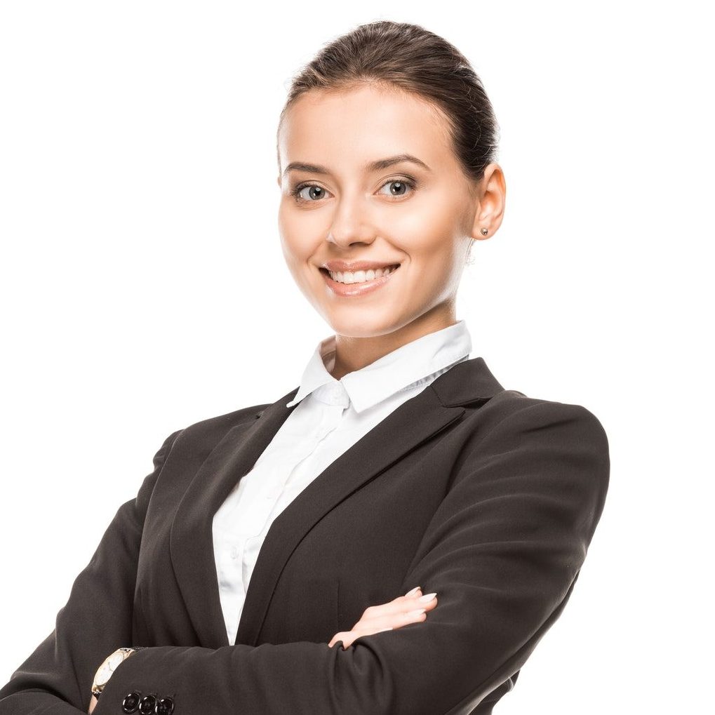 happy-young-businesswoman-in-suit-looking-at-camera-with-crossed-arms-isolated-on-white-e1623128154534.jpg